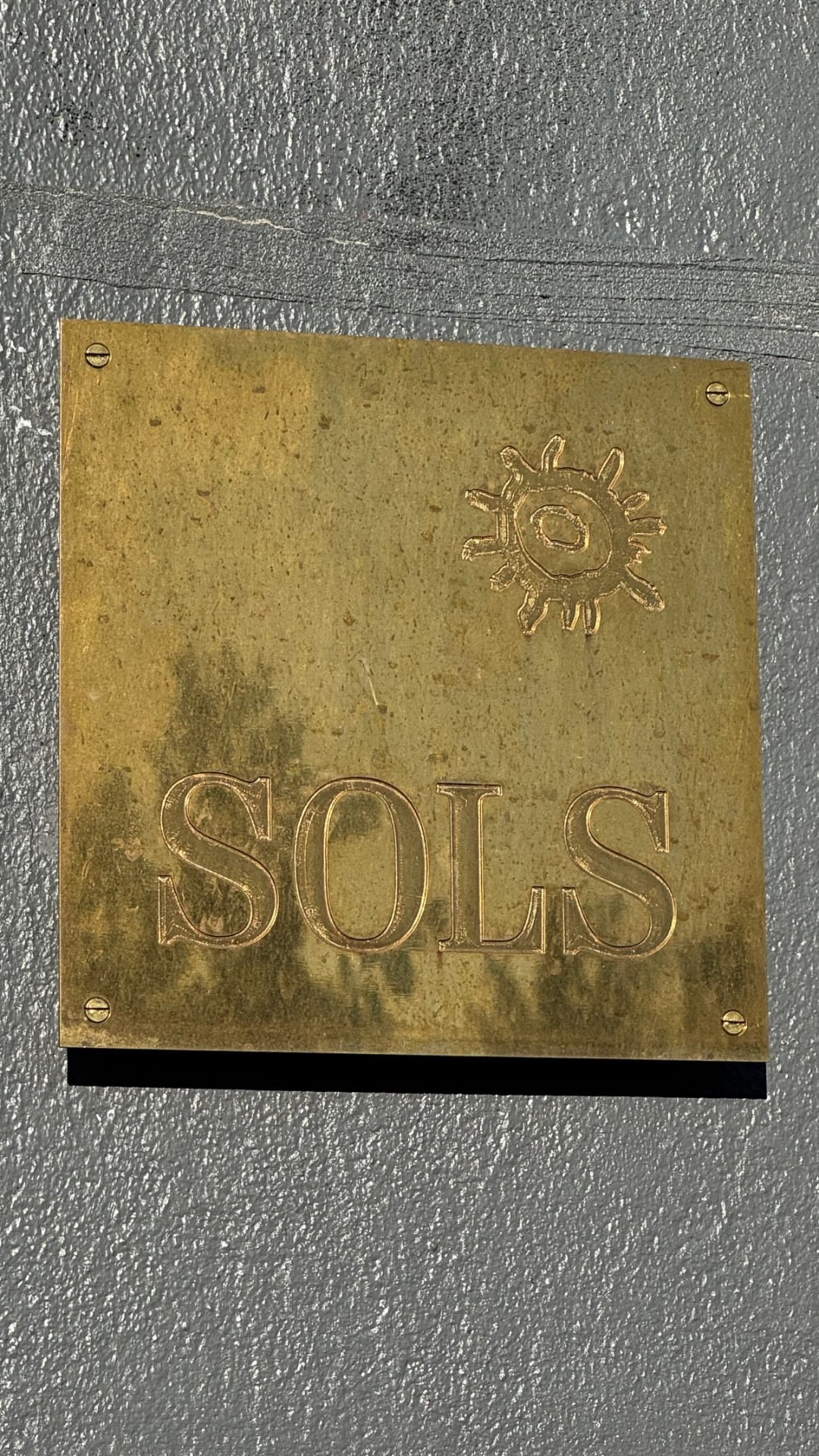 Sols brass sign